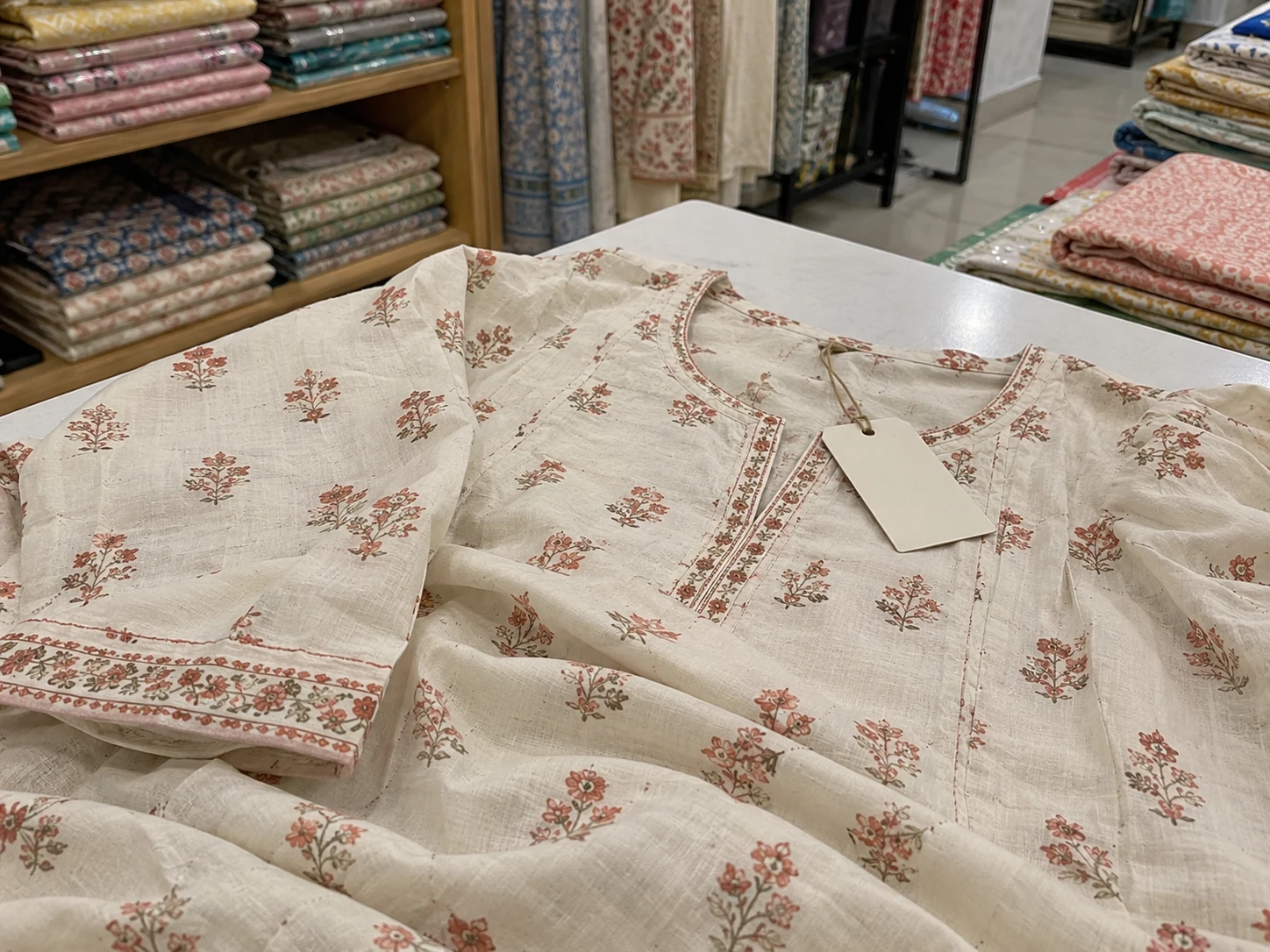 AI-generated detail of a floral cotton kurta neckline and stitched binding